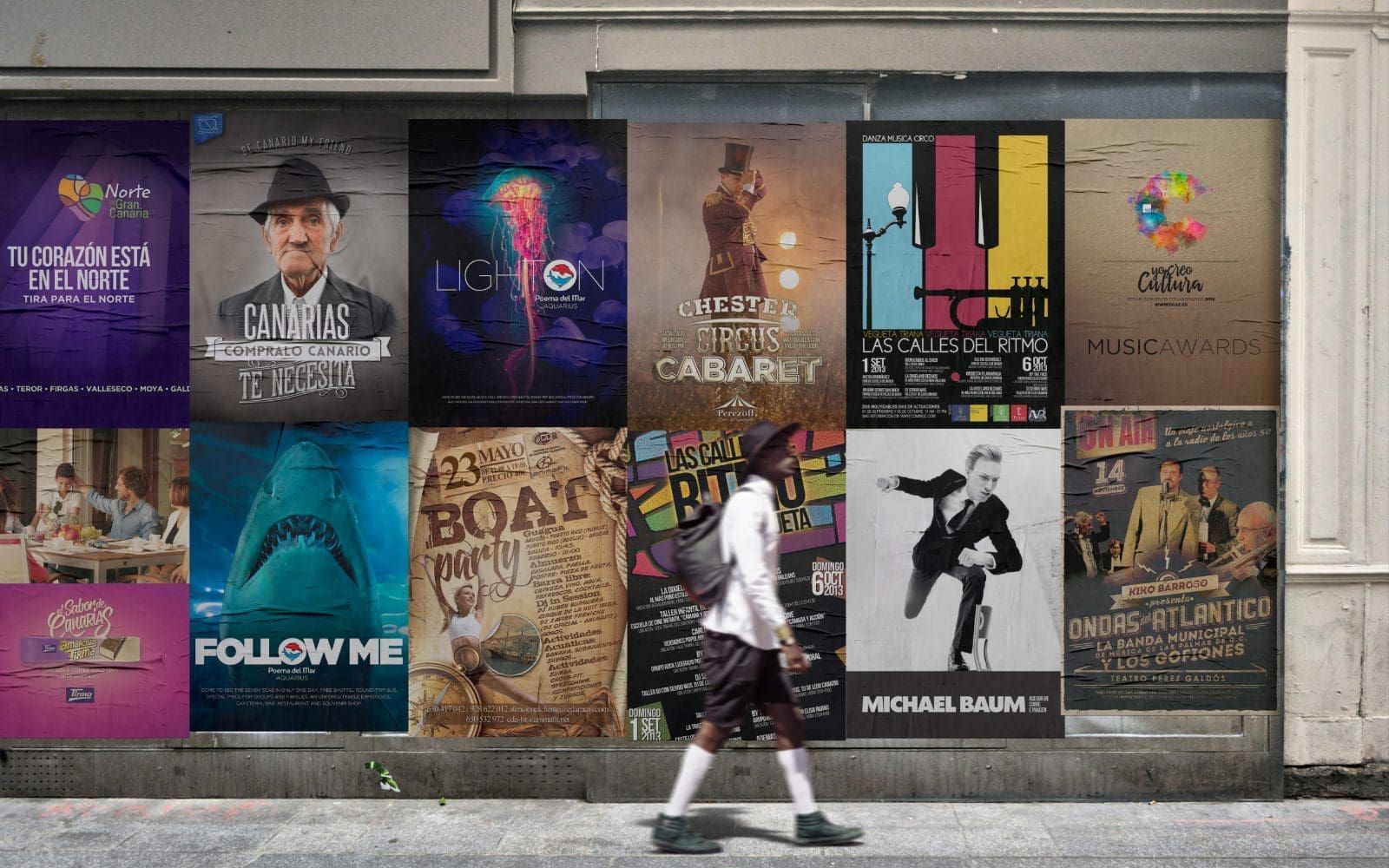 Muro con 12 carteles pegados. Todos diseñados por nuestro equipo