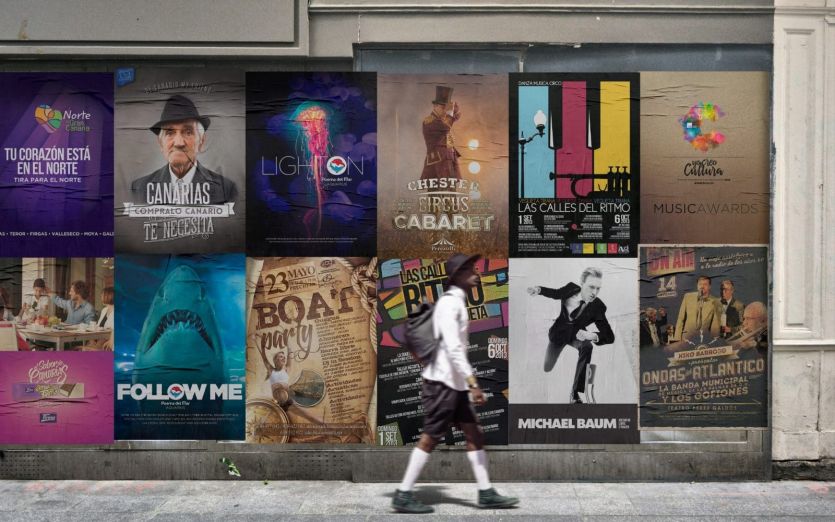 Muro con 12 carteles pegados. Todos diseñados por nuestro equipo